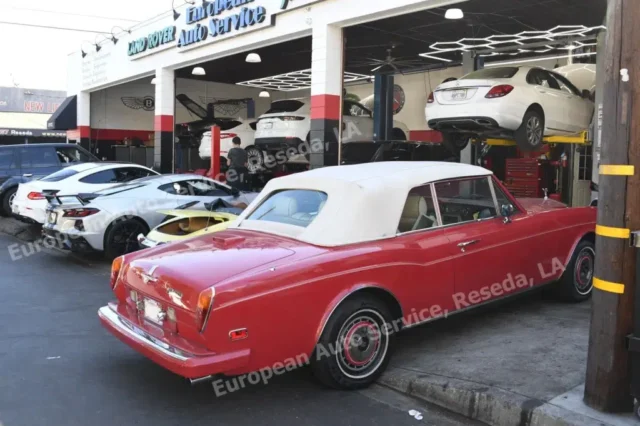 Classic red Rolls-Royce Corniche convertible outside European Auto Service in Reseda, Los Angeles