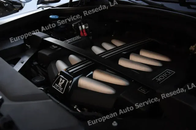Close-up of Rolls-Royce 6.75L V12 engine during diagnostics at European Auto Service in Los Angeles
