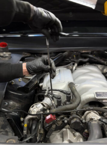 Bentley Engine Repair in Progress at European Auto Service Technician performing engine repair on Bentley vehicle at European Auto Service in Reseda, Los Angeles