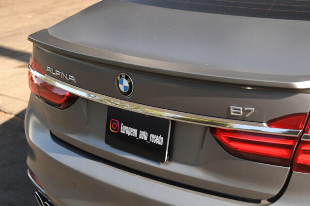 Rear view of Alpina B7 with emblem at European Auto Service Close-up of Alpina B7 rear badge and tail lights at European Auto Service in Reseda, LA