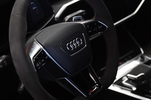 Audi RS6 Steering Wheel and Interior at Reseda Auto Service Audi RS6 steering wheel with red stitching and multifunction controls inside LA repair shop