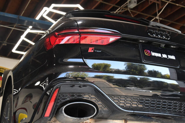 Rear View of Audi RS6 Showing Tail Light and RS Badge at Reseda Auto Shop Close-up of Audi RS6 taillight and RS badge during inspection at European Auto Service Reseda