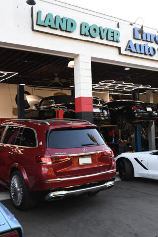 Maybach GLS600 Parked at Mercedes Workshop in Reseda Red Maybach GLS600 SUV in front of European Auto Service shop in Reseda