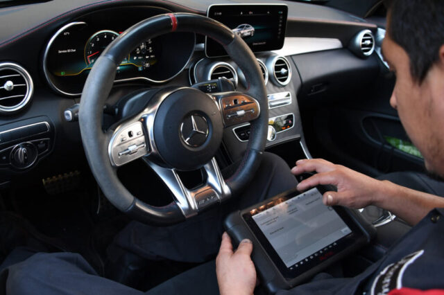 Mercedes-Benz Interior Diagnostic Scan at European Auto Service in Reseda Technician scanning Mercedes interior diagnostics with tablet at European Auto Service