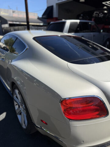 Bentley Continental GT Rear Profile at Los Angeles Repair Shop Rear view of silver Bentley Continental GT at European Auto Service luxury car repair shop in Reseda