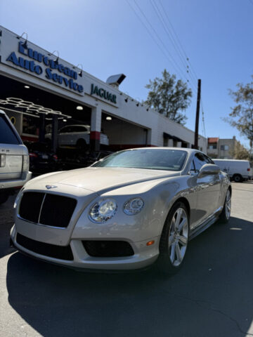 Bentley Continental GT at European Auto Service Shop in Reseda Silver Bentley Continental GT parked outside European Auto Service facility in Reseda, Los Angeles County
