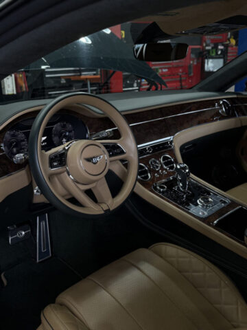 Bentley Flying Spur Interior Service at Reseda Shop Bentley Flying Spur luxury interior with cream leather and wood veneer during service at European Auto Service