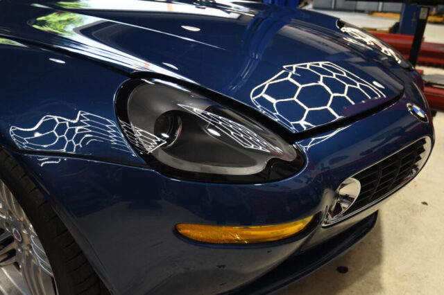 Close-up of BMW Z8 front end showing iconic headlight design and sculpted hood at Los Angeles repair shop