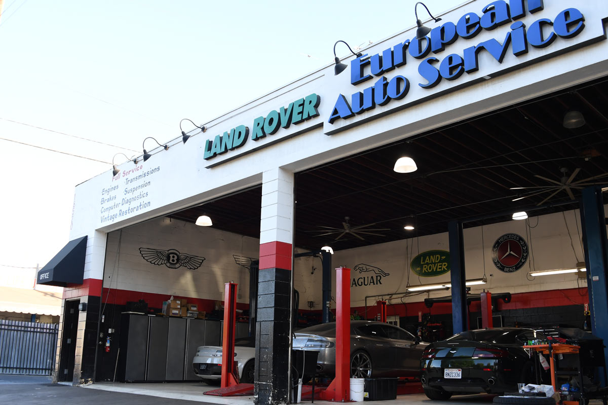European Auto Service full storefront in Reseda showing service bays with Bentley Jaguar Land Rover and Mercedes brand logos and Full Service signage