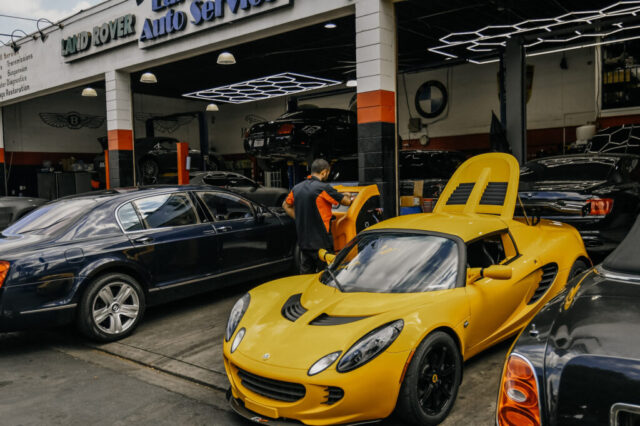 Bentley Continental and Lotus at European Auto Service Reseda Bentley Continental and Lotus Elise outside European Auto Service climate control repair facility in Reseda with Land Rover and Aston Martin service bays