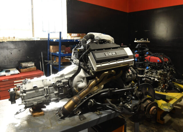 bmw-engine-gearbox-transmission-drivetrain-repair BMW engine and transmission assembly removed for professional drivetrain repair and rebuild