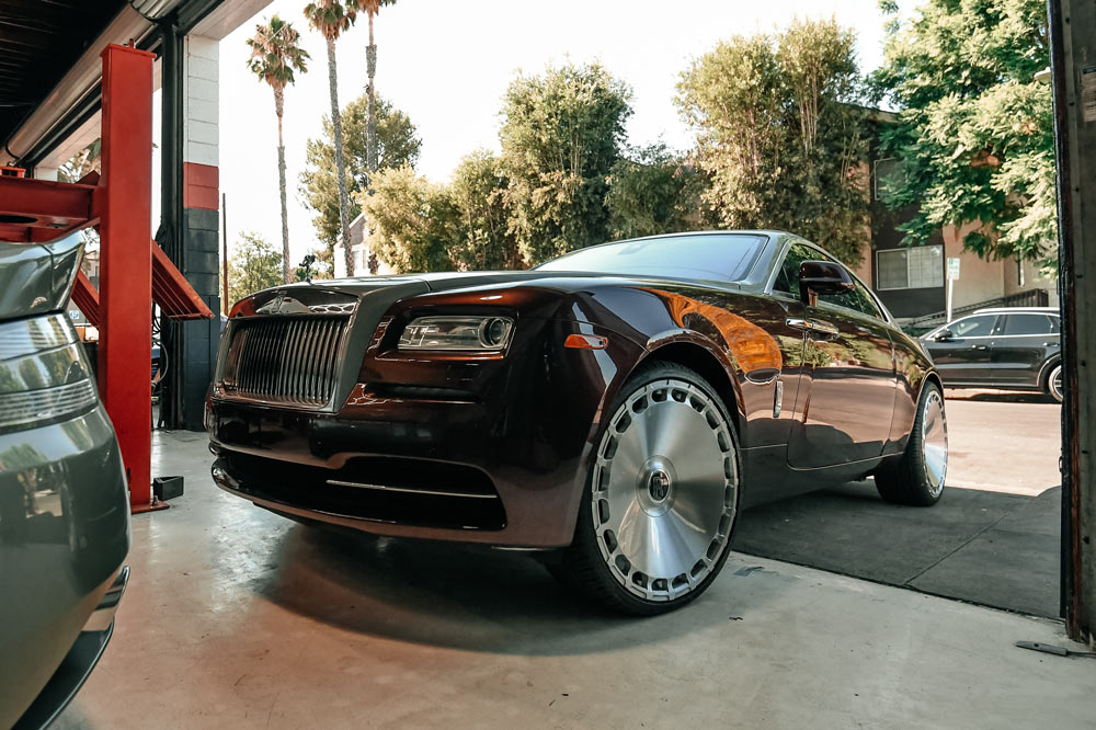 Rolls-Royce luxury car inside European Auto Service repair facility in Los Angeles