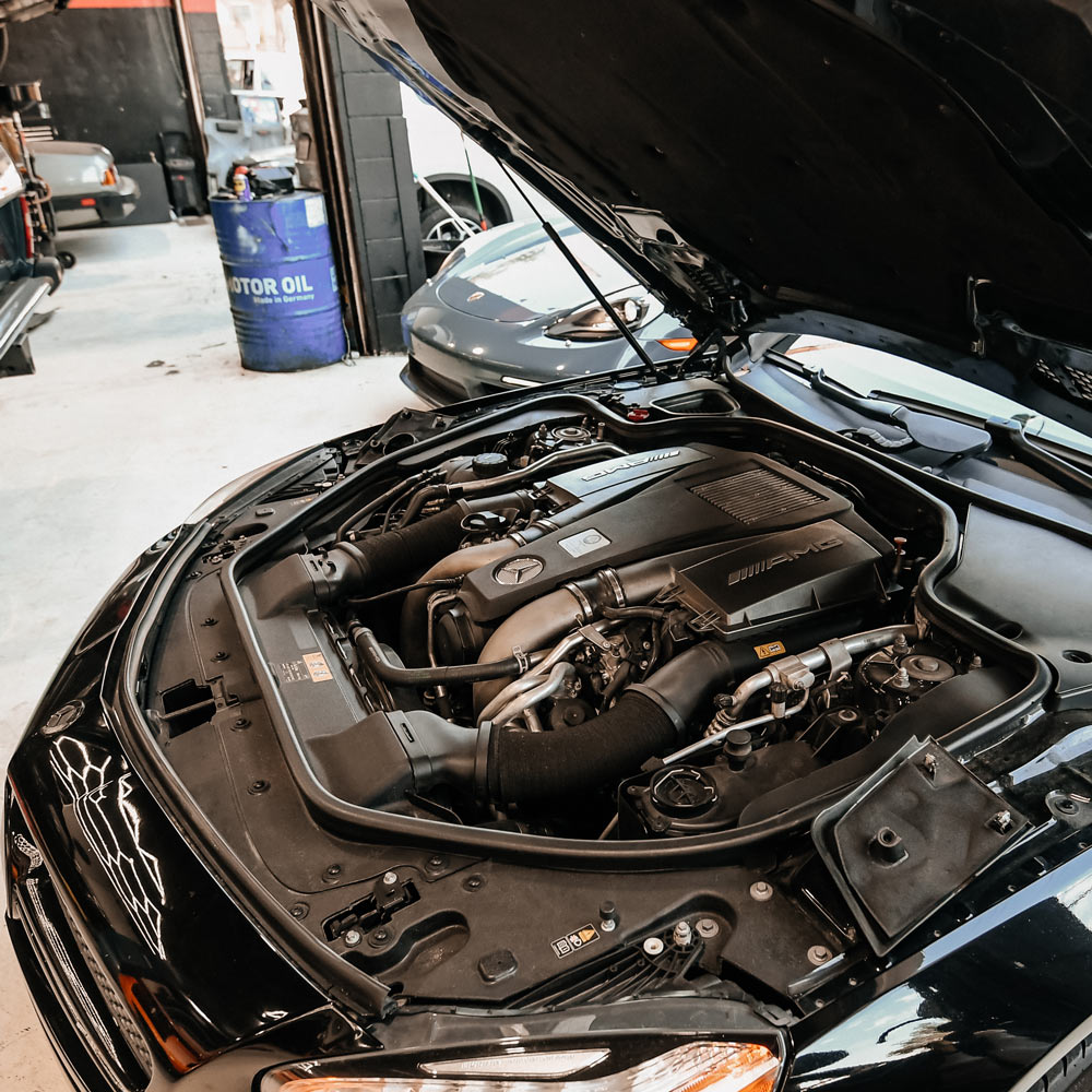 Mercedes AMG engine bay inspection for electrical diagnostics and repair in Los Angeles luxury auto shop
