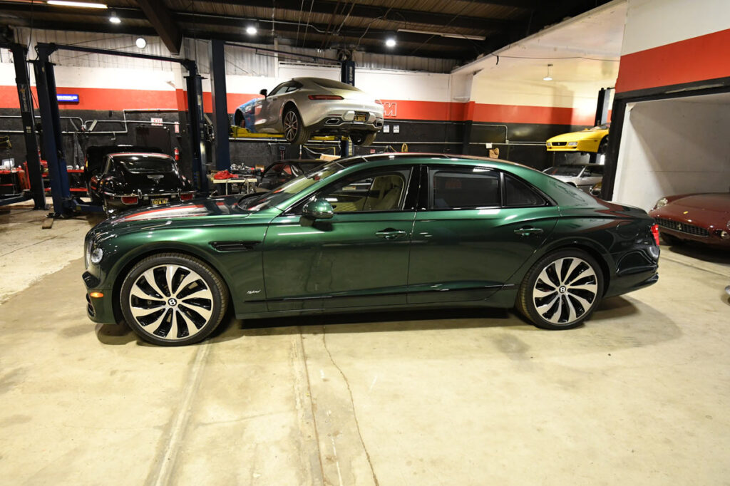 Bentley Flying Spur Hybrid in racing green after body repair at European Auto Service in Reseda
