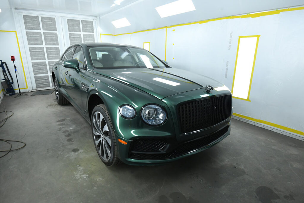 Bentley Flying Spur in our paint booth after color-matched green refinishing
