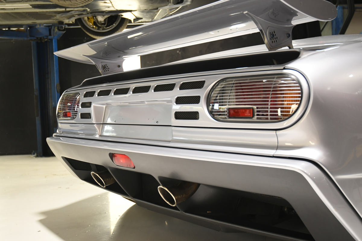 Bugatti EB110 SuperSport rear active wing raised with twin center-exit exhaust at our Reseda shop