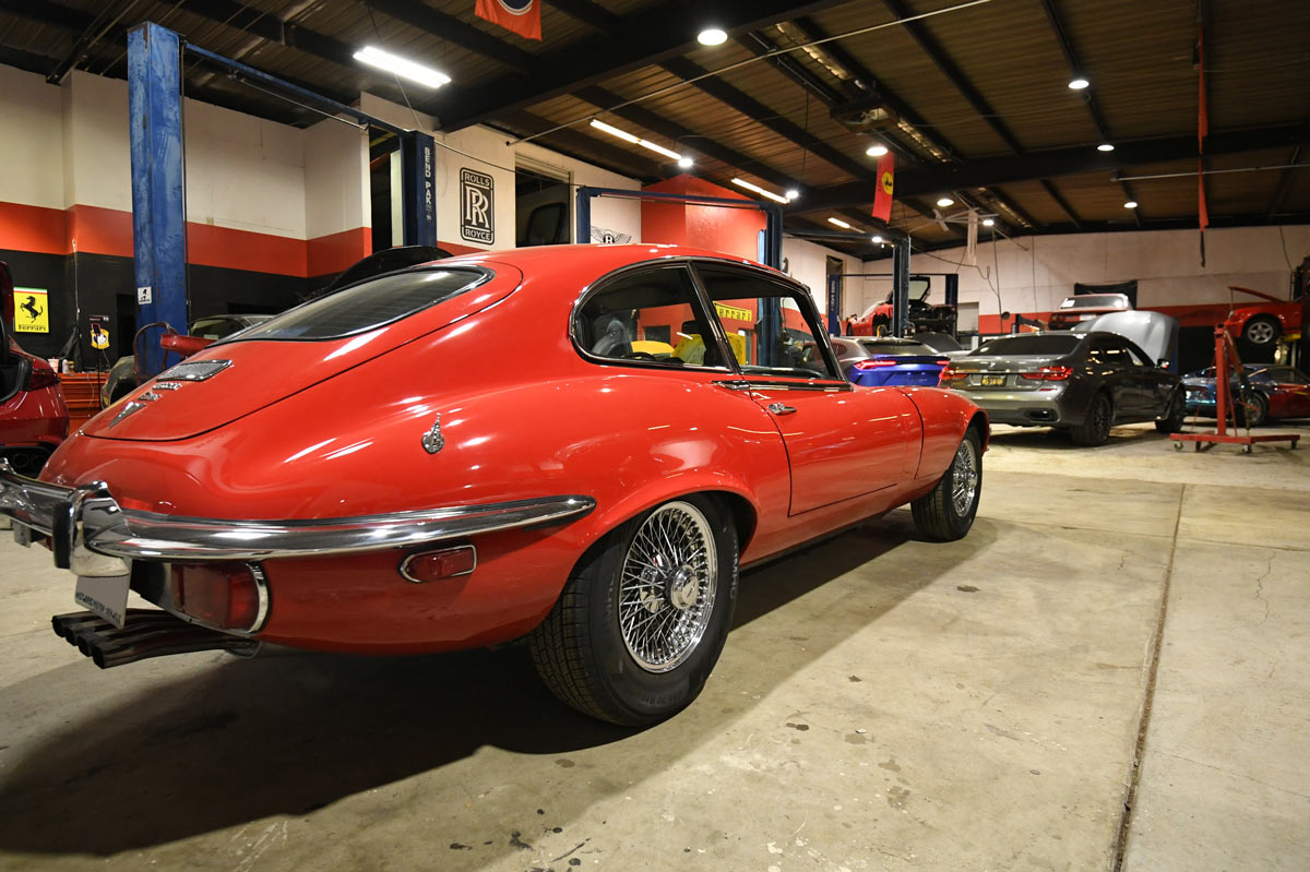 Restored 1971 Jaguar E-Type V12 rear three-quarter view after completion